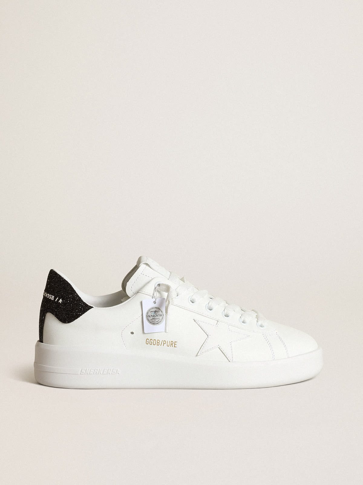 Sneakers Purestar en cuir blanc avec étoile ton sur ton et contrefort en cristaux Swarovski noirs